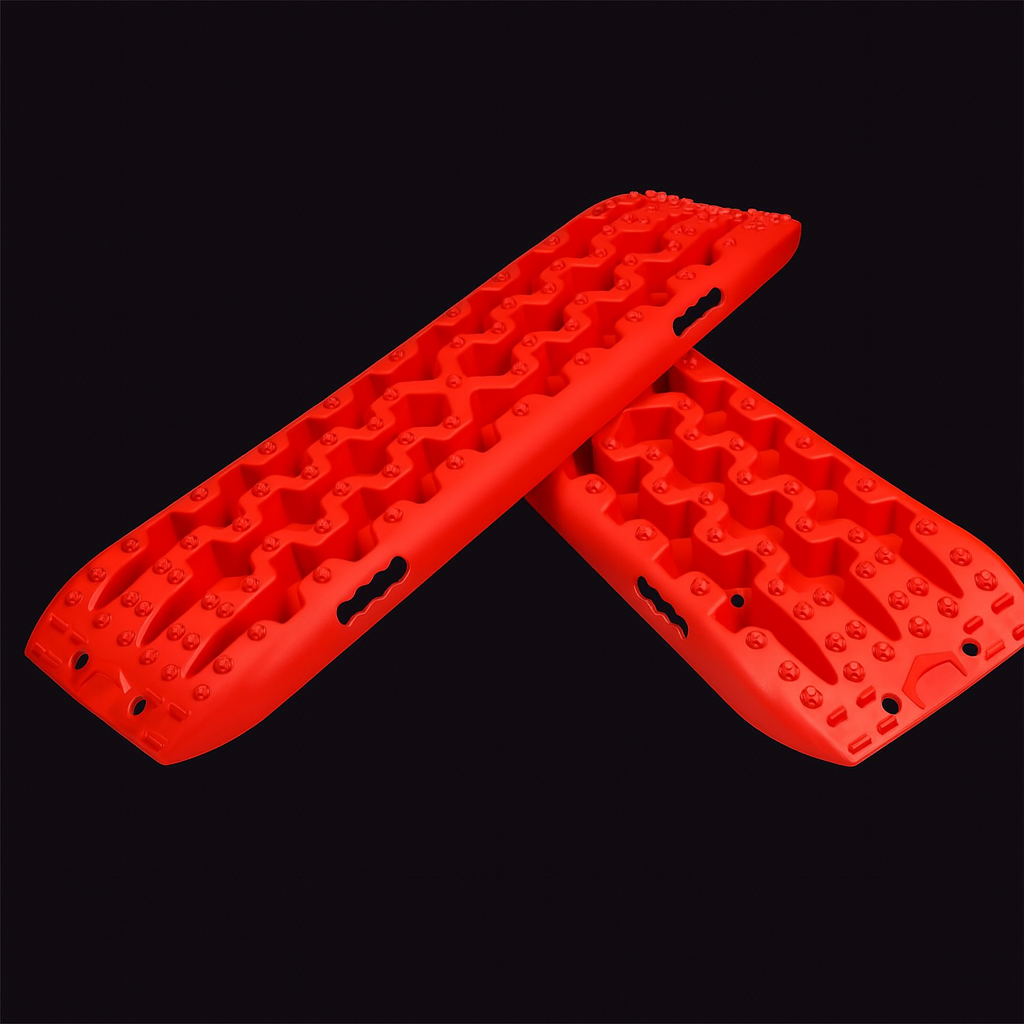 Bright red X-BULL recovery boards crossed on a dark background